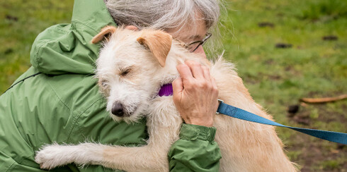 Woman hugging dog